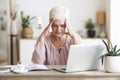 Matured business woman feeling tired, overworking at home Royalty Free Stock Photo