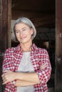 Matured farm woman with crossed arms Royalty Free Stock Photo