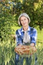 Matured farm woman with freshly baked bread