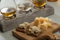 Matured strong british blue cheese stilton keeping in ceramic bowl under wax layer, cheese and whiskey pairing Royalty Free Stock Photo