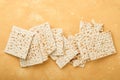 Matzah Passover celebration concept. Traditional ritual Jewish bread on sand color old wall background. Passover food. Pesach