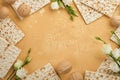 Matzah Passover celebration concept. Traditional ritual Jewish bread on sand color old wall background. Passover food. Pesach