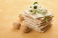 Matzah Passover celebration concept. Traditional ritual Jewish bread on sand color old wall background. Passover food. Pesach