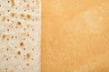 Matzah Passover celebration concept. Traditional ritual Jewish bread on sand color old wall background. Passover food. Pesach