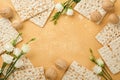 Matzah Passover celebration concept. Traditional ritual Jewish bread on sand color old wall background. Passover food. Pesach