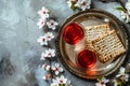 Matzah and spring flowers on light blue background. Jewish holiday bread matza or matzoh