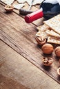 Matzah and walnut. Traditional ritual Jewish bread on old wooden rustic background. Passover food. Pesach Jewish holiday of Passov