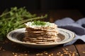 matzo bread stacked on a ceramic plate