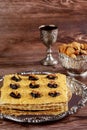 Matzo cake with silver kiddush cup and walnuts Royalty Free Stock Photo