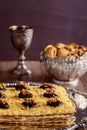 Matzo cake with silver kiddush cup and walnuts Royalty Free Stock Photo