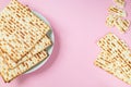 Matzo on a pink background. Traditional Jewish food.  for  regilious spring holiday of Pesach. Happy Passover. Copy space Royalty Free Stock Photo