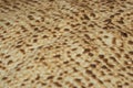 Matzo texture, a top view of a piece of traditional wheat dry bread served on Hebrew Passover