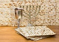 Matzo, wine and menorah for passover celebration on the wooden table Royalty Free Stock Photo