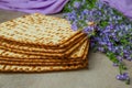 Matzoh is decorated with flowers and is kosher for Passover.