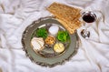 Matzoh jewish holiday bread Jewish family celebrating passover with traditional seder plate Royalty Free Stock Photo