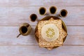 Matzoh jewish passover bread in the traditional seder plate with kipah Royalty Free Stock Photo