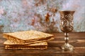 Matzos bread with kiddush cup of wine. Jewish pesah holiday