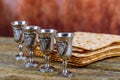 Matzot four glasses of red wine symbols of Passover Royalty Free Stock Photo