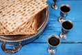 Matzot and four glasses red wine symbols of Passover Royalty Free Stock Photo