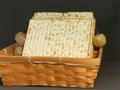 Matzot in a wicker basket on black background. Pesach-Jewish easter.