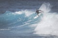 MAUI, HI - MARCH 10, 2015: Professional surfer rides a giant wave at the legendary big wave surf break 