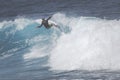 MAUI, HI - MARCH 10, 2015: Professional surfer rides a giant wave at the legendary big wave surf break 
