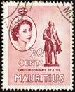 MAURITIUS - CIRCA 1953: A stamp printed in Mauritius shows Labourdonnais statue and portrait of Queen Elizabeth II, circa 1953.