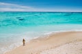 Mauritius, Indian Ocean - portrait of a girl walking along the beach with tourists from all over the world visiting the paradise