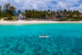 Mauritius vacation, couple man and woman in a kayak in a blue ocean in Mauritius.