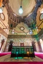 Mausoleum at Mamluk era Mosque and Madrasa of Sultan Hassan with colorful marble mosaic, and carved inscription, Cairo