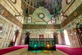 Mausoleum at Mamluk era Mosque and Madrasa of Sultan Hassan with colorful marble mosaic, and carved inscription, Cairo