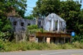 Building destroyed by Tamil Sinhalese civil war beside bus stop in Jaffna Peninsula Sri Lanka