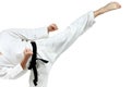 Mawashi geri kick is doing sportsman in a white karategi Royalty Free Stock Photo