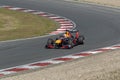 Max verstappen in a formule 1 car comes racing outof the corner on circuit zandvoort