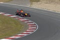 Max verstappen in a formule 1 car race in the corner on circuit zandvoort