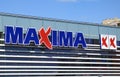 Maxima retail shop logo on the wall
