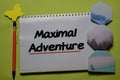 Maximal Adventure write on a book isolated on office desk