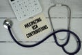 Maximizing HSA Contributions text with Stethoscope and calculator on wooden background Royalty Free Stock Photo
