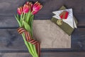 9 May background - George ribbon, note paper, red flowers front-line letters, military cap and orders on the wooden background.