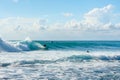 5 May 2019 : Balangan Beach, Bali, Indonesia - Man riding wave on a sunny summers day