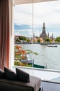 Bedroom with couch by the large bay window with Wat Arun Temple