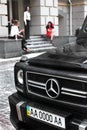 May 21, 2011, KIEV - Ukraine. Beautiful rooms on the car. Close-up front view Mercedes-Benz G63 AMG against the background of girl