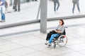 woman with a wheelchair is alone traveling through the exhibition hall at the Bundestag dome