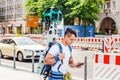 Young man from google corporation is working with huge backpack with 3D panoramic camera used for