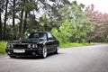 Kiev, Ukraine. May 17, 2014. BMW M5 E34 against the background of the forest Royalty Free Stock Photo