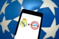 May 6, 2024, Brazil. The emblems of Real Madrid and FC Bayern MÃÂ¼nchen are displayed on a smartphone Royalty Free Stock Photo