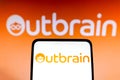 May 14, 2022, Brazil. In this photo illustration the Outbrain logo seen displayed on a smartphone and in the background