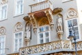 Architectural details balconies and statues on the facade of an ancient building in the center of