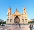 Tourists on the Istvan square admire the magnificent architecture of St. Stephen basilica