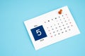 May 2024 calendar page with push pin on blue background Royalty Free Stock Photo